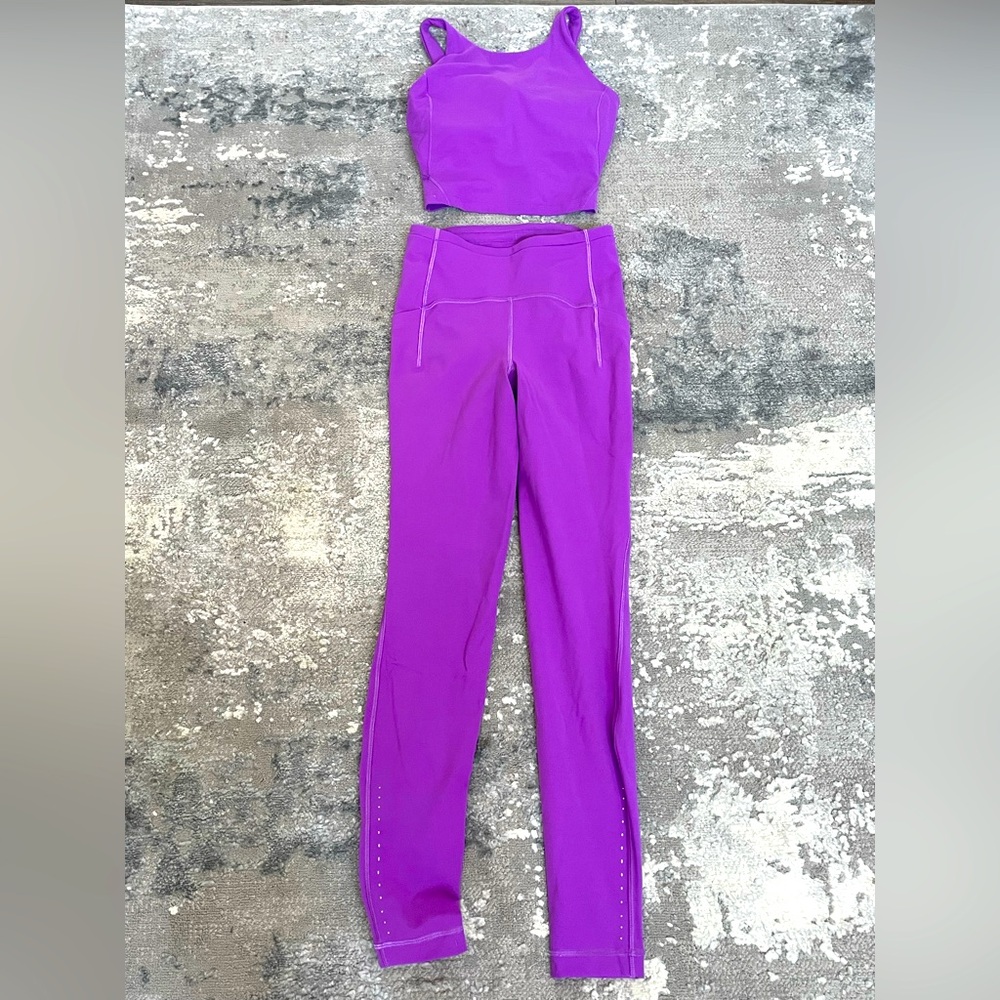 Lululemon leggings and tank. Beautiful set. NWOT Size 2 top. Size 4 leggings.